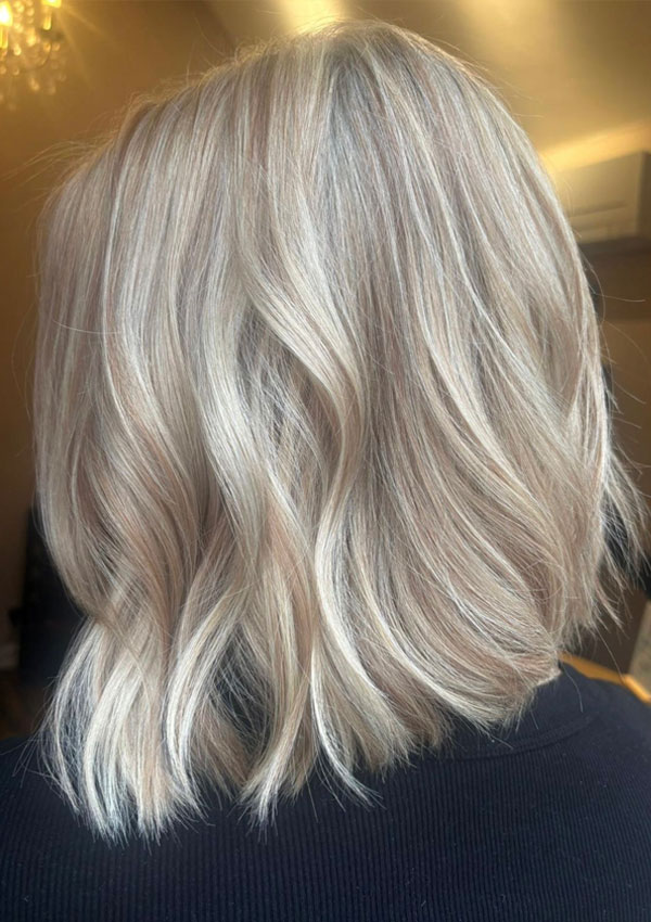 Lady with new blonde colour service