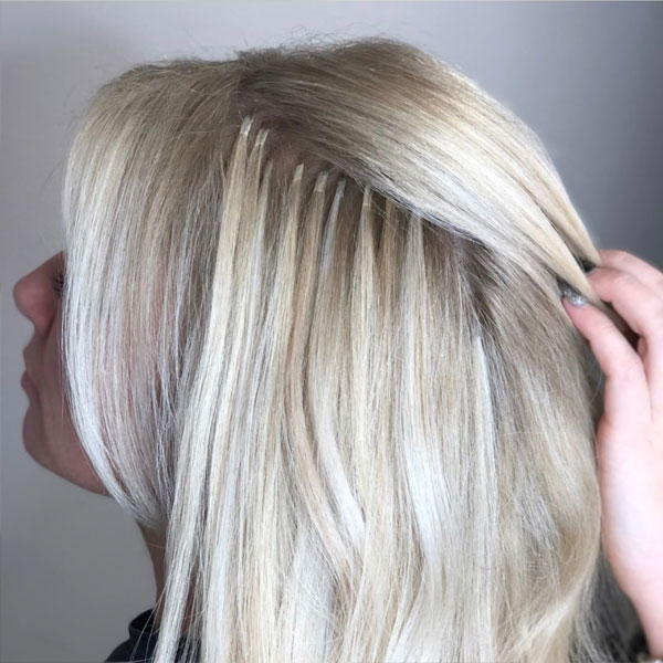 Lady having hair extensions