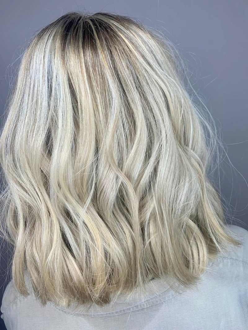 Beautiful platinum blond choppy shoulder length hair styled by Head Office