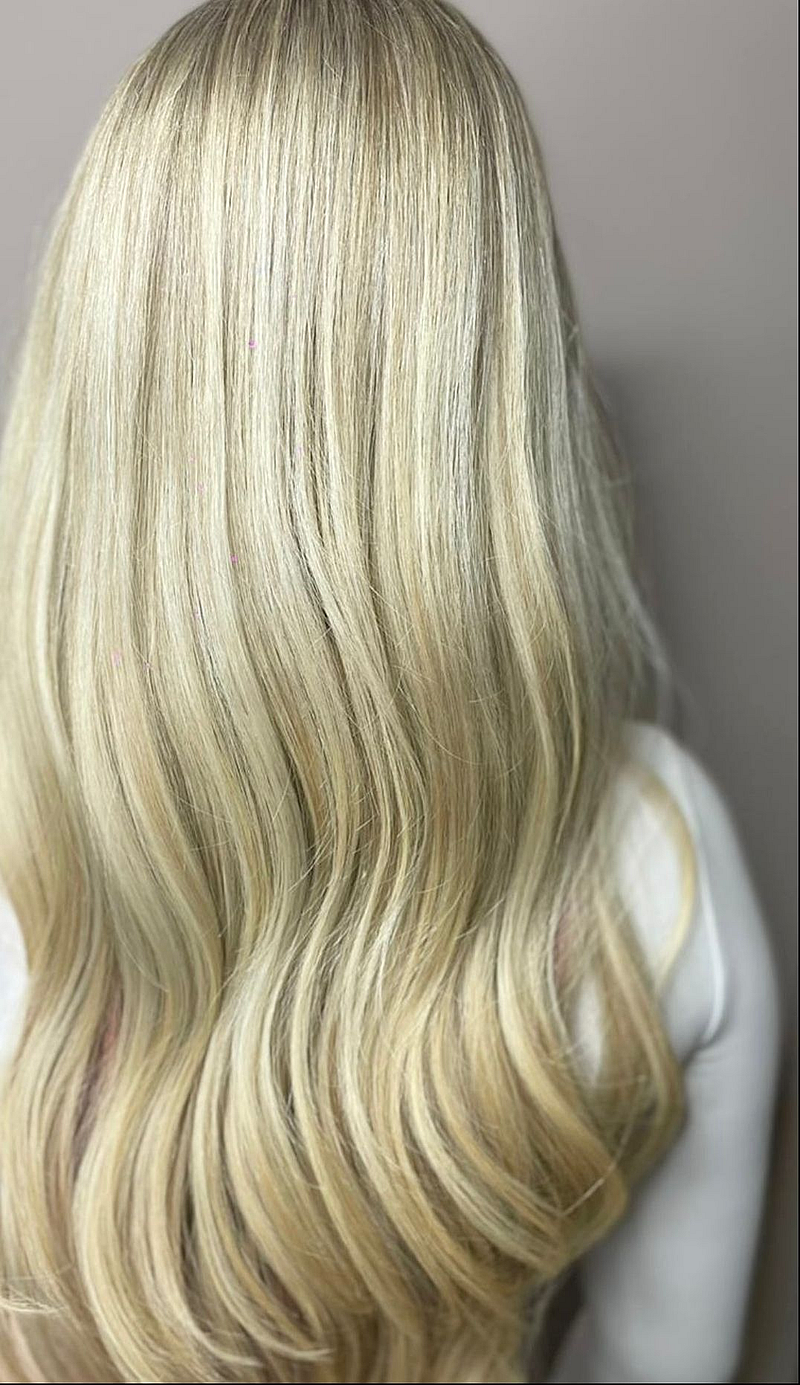 Woman with long light blonde hair that's been highlighted